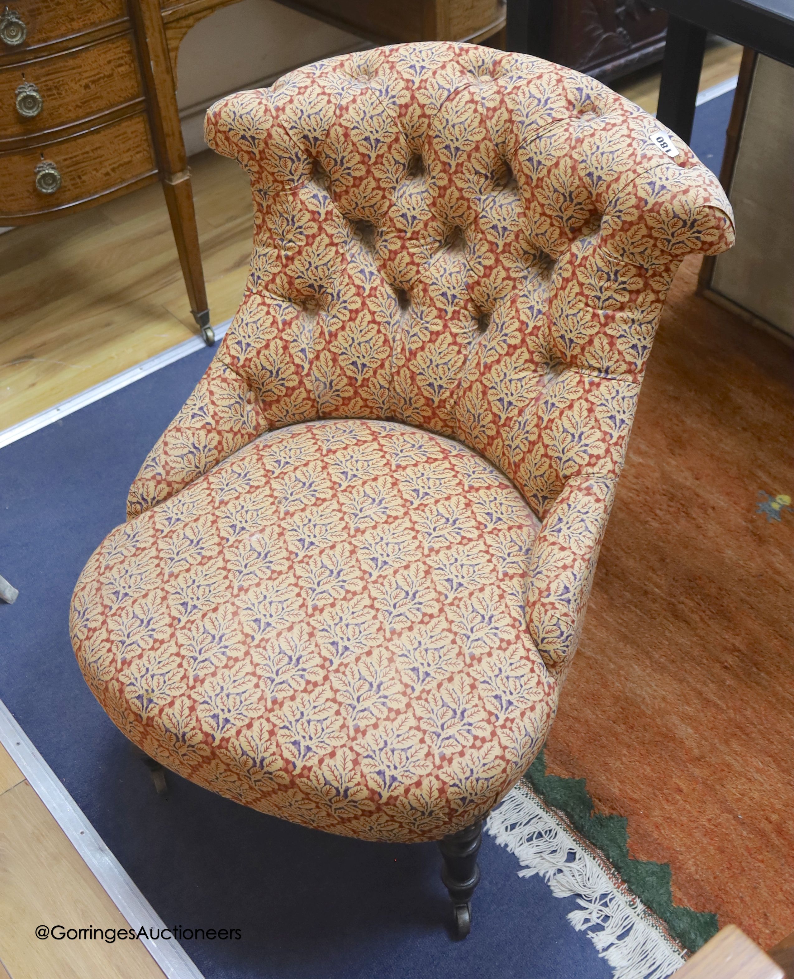A Victoiran mahogany framed nursing chair, on front turned legs